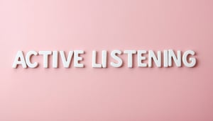 The image shows the word ACTIVE LISTENING written in white letters in the center of a soft pink coloured background-3