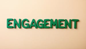 The image shows the word ENGAGEMENT written in sage green letters in the centre of a light brown coloured background i want the font to look young and be in line with education theme