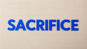 The image shows the word SACRIFICE written in blue letters in the center of a fabric material